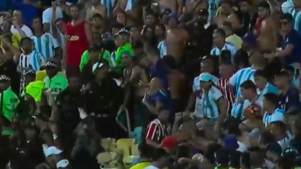 Brazilian police pictured advancing towards fans in the crowd at the Estadio do Maracana before a World Cup qualifier between Brazil and Argentina in November 2023